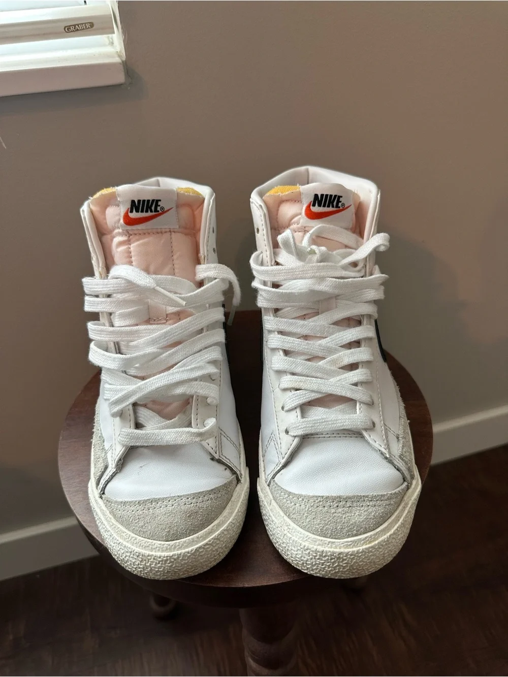 Nike White High-Top Sneakers with Black Swoosh and Pink Tongue
